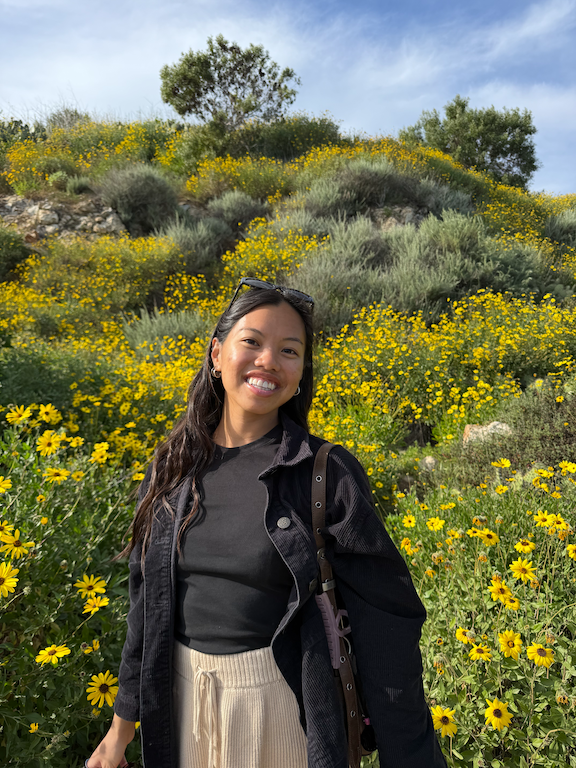 Caro in a field of flowers