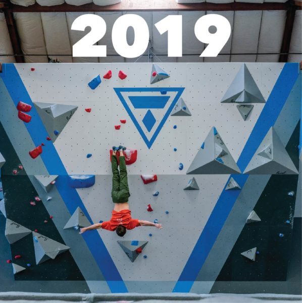 Climber hanging on wall at Training Center