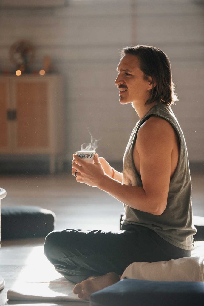 Bennet sitting with some tea